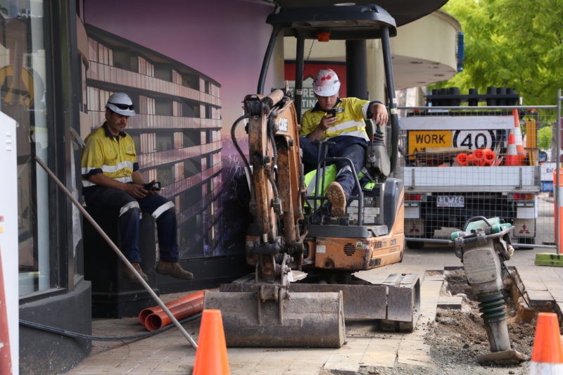 Photograph of men working at a working site